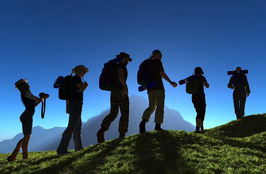 group of hikers on green mountain landscape