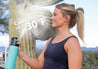 gomist cools the air up to 30 degrees teal gomist bottle cooling down woman in athletic wear