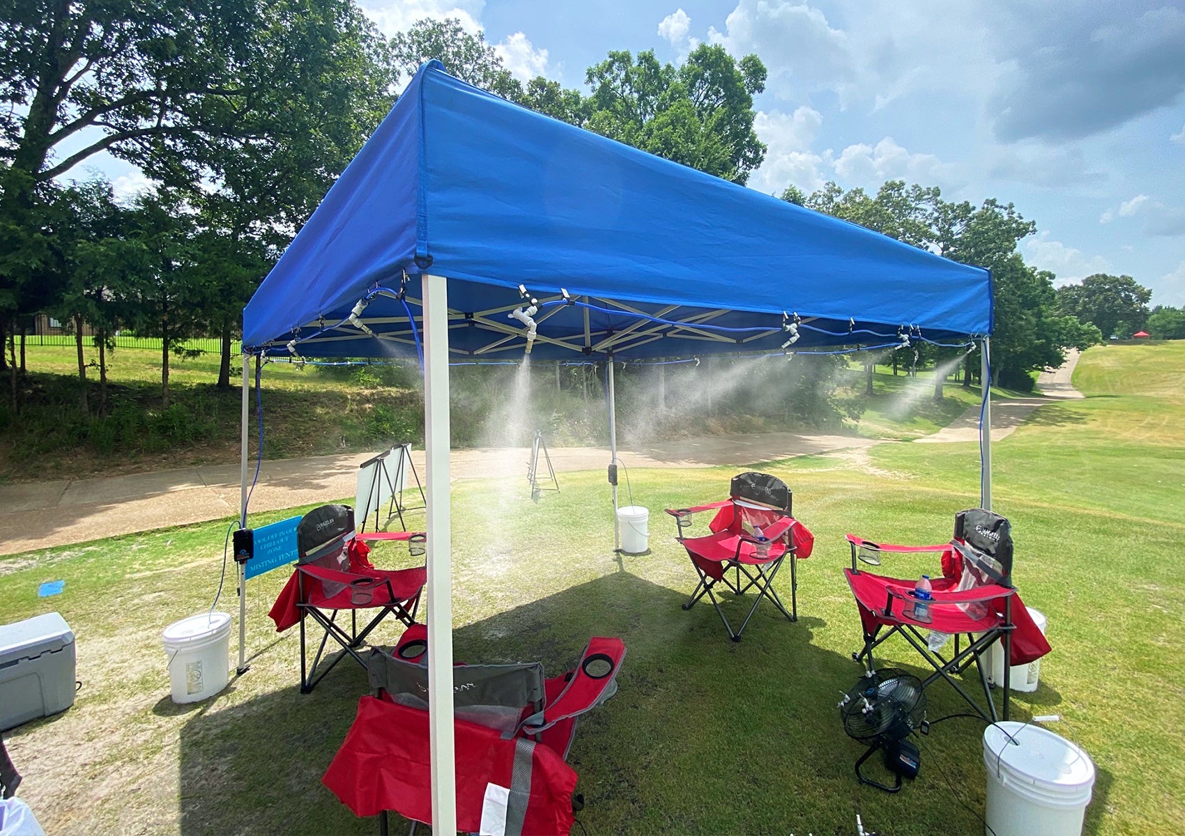 misting system attached to tent on golf course