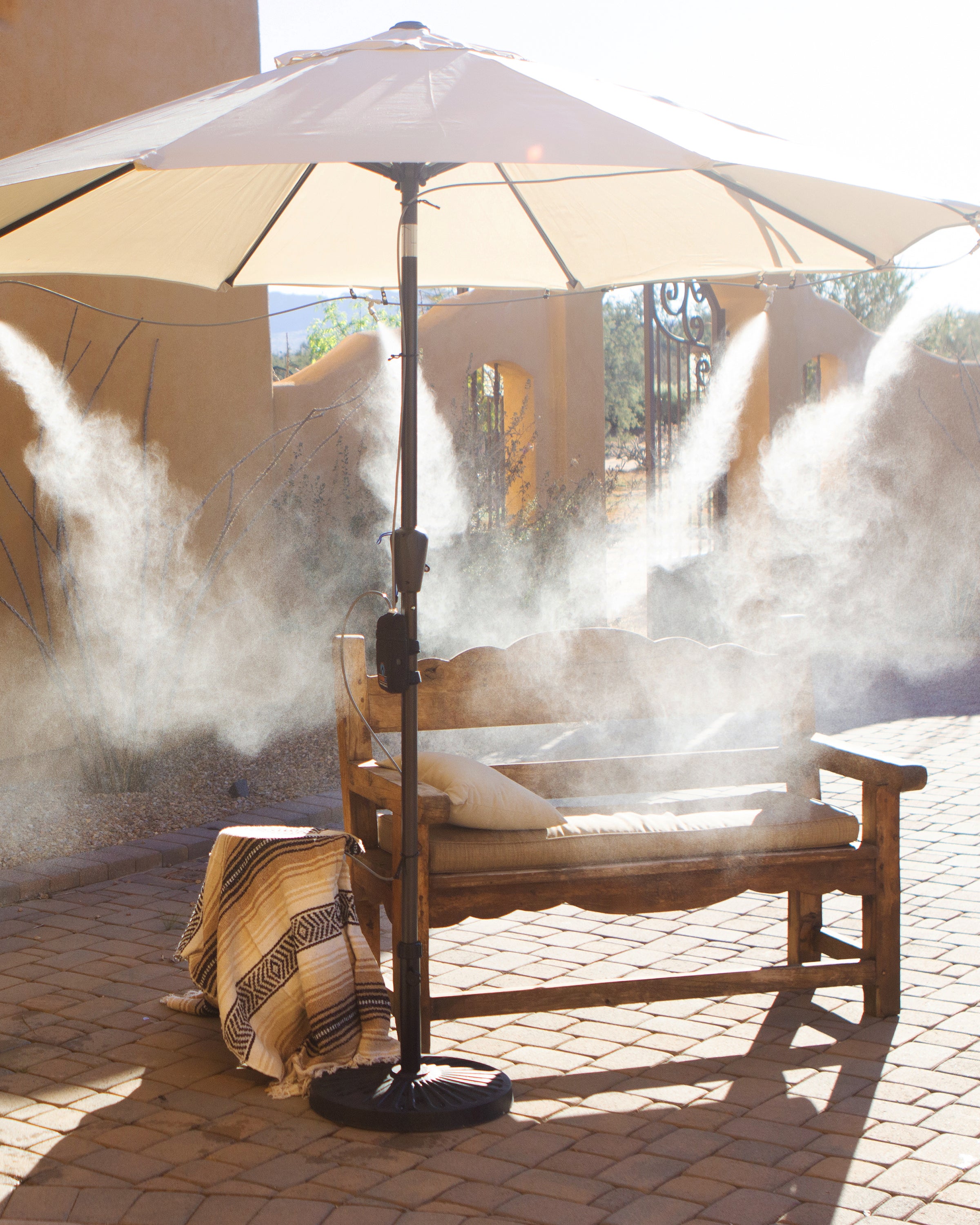 powerful misting system attached to patio umbrella misting patio