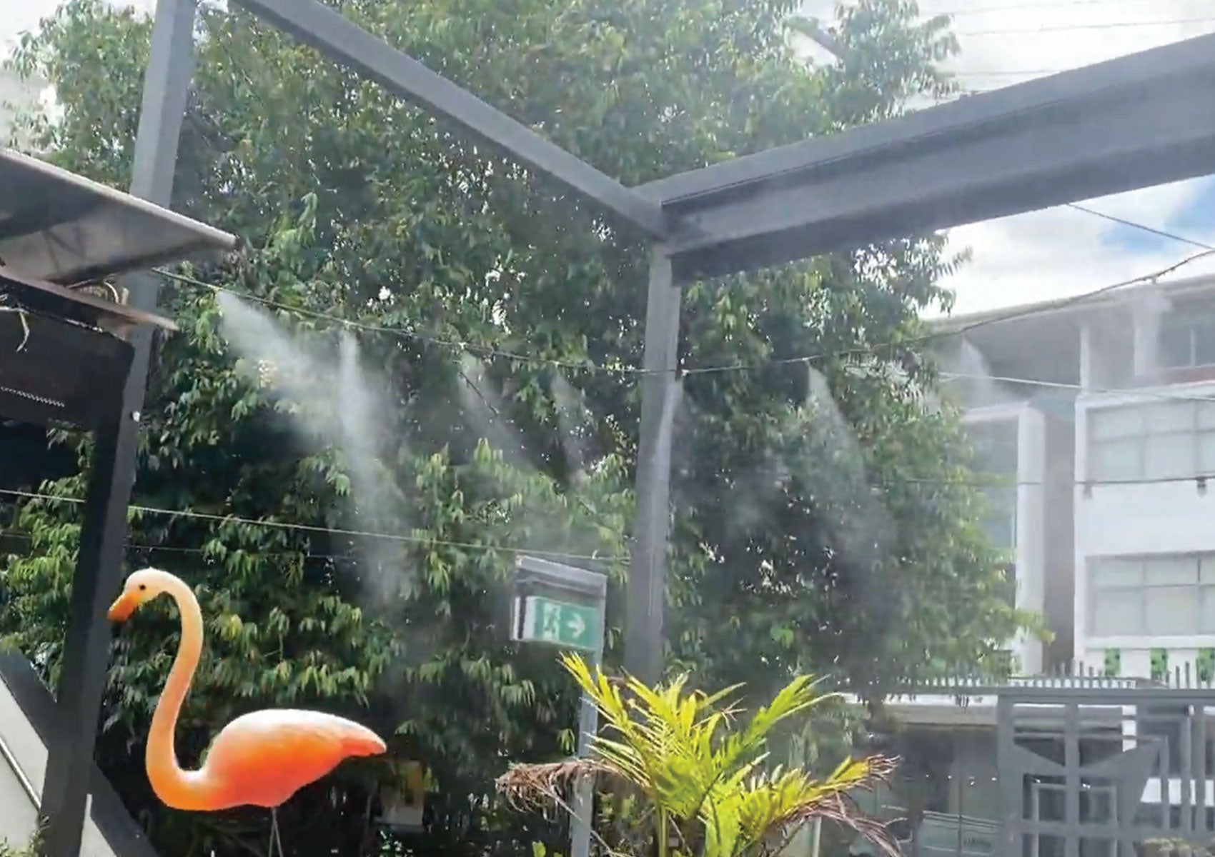 high-pressure misting system in backyard