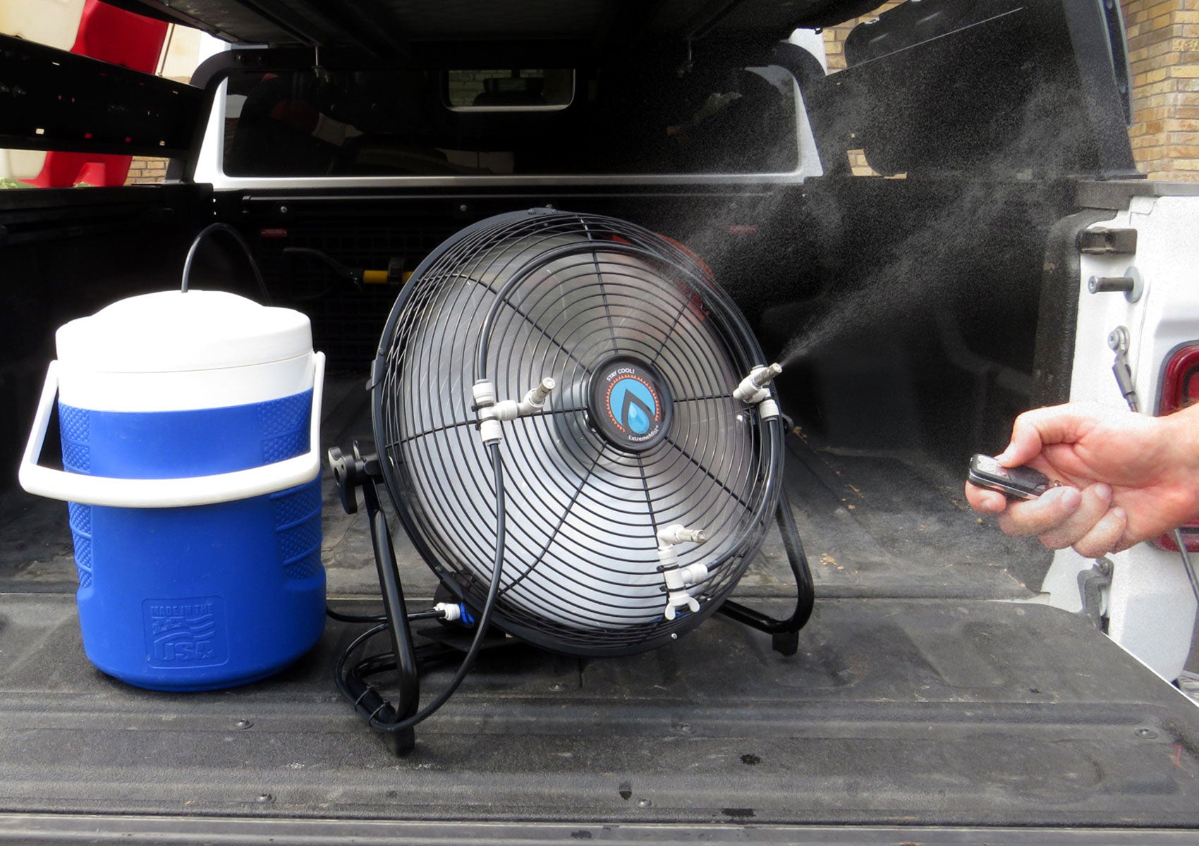 misting fan with water cool and wireless remote in truck bed